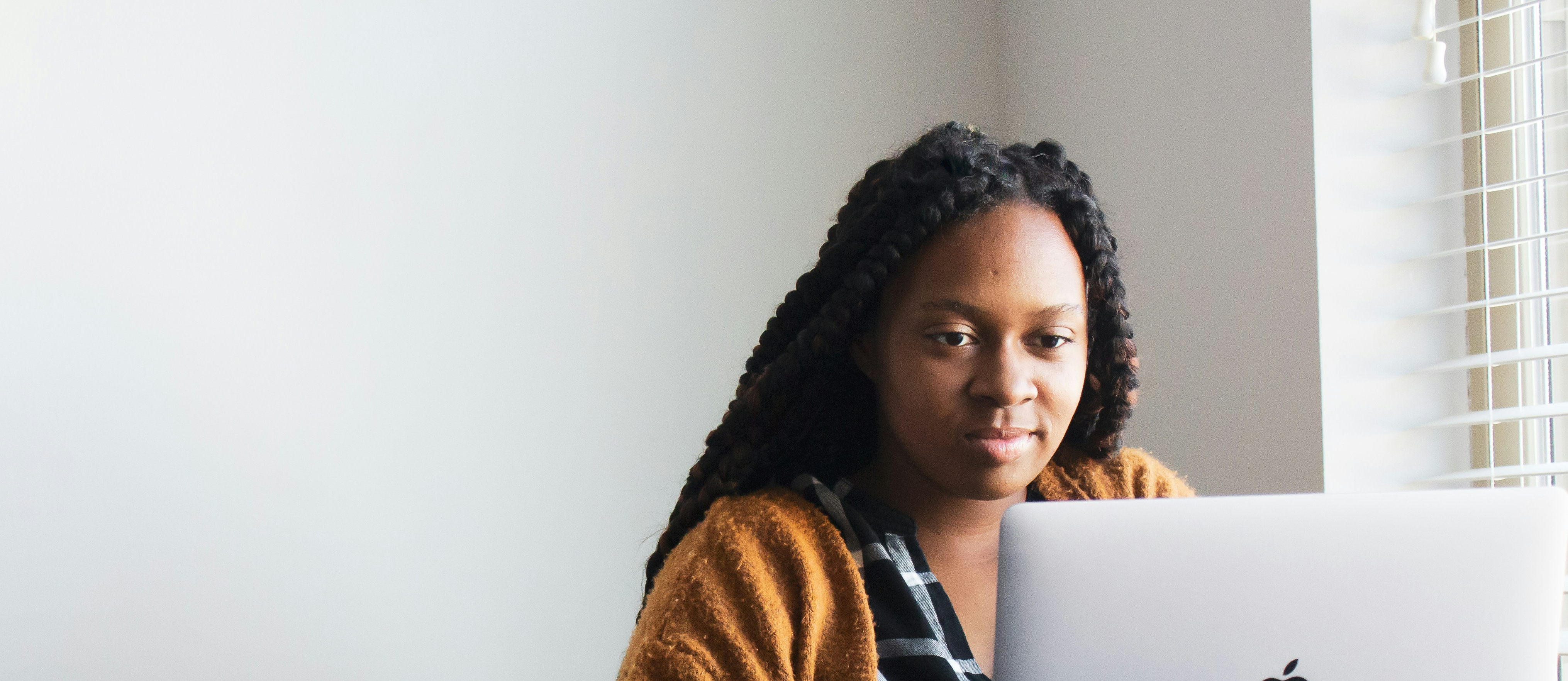 person using laptop at desk